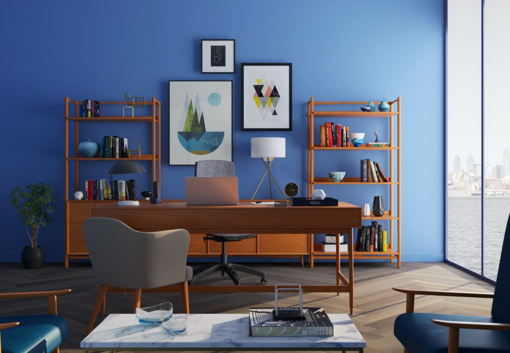 office desk in front of a blue wall