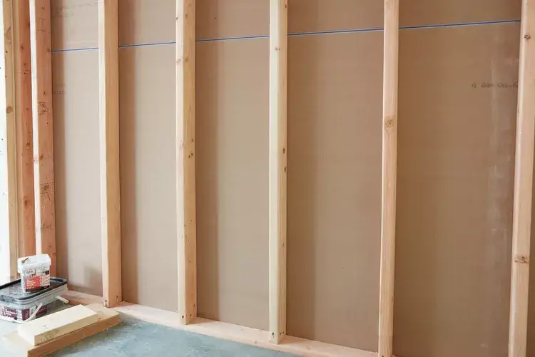 picture of studs behind a wall