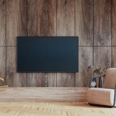 largte tv mounted on wood paneling