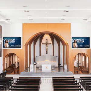tvs mounted in a church. Once on each side of the alter.