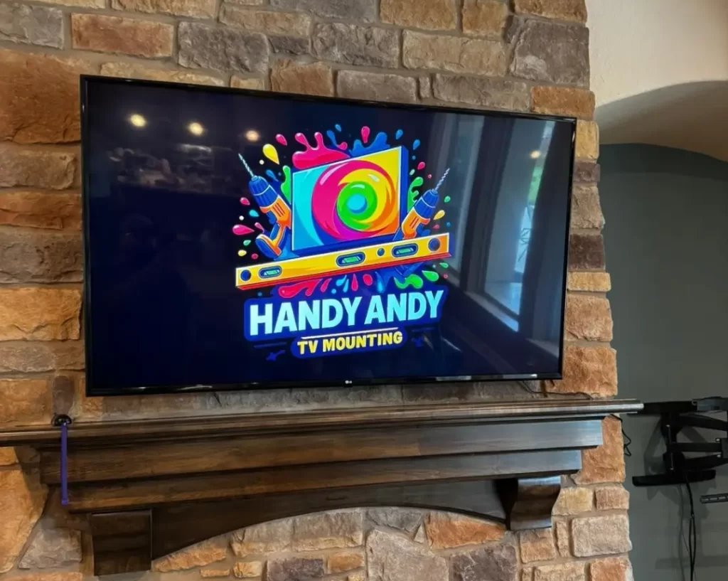 tv mounted over a fireplace in houston on stone tile