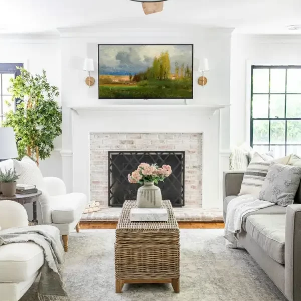 Vizio P-Series Quantum X above a fireplace in a white room. Tv looks like art.